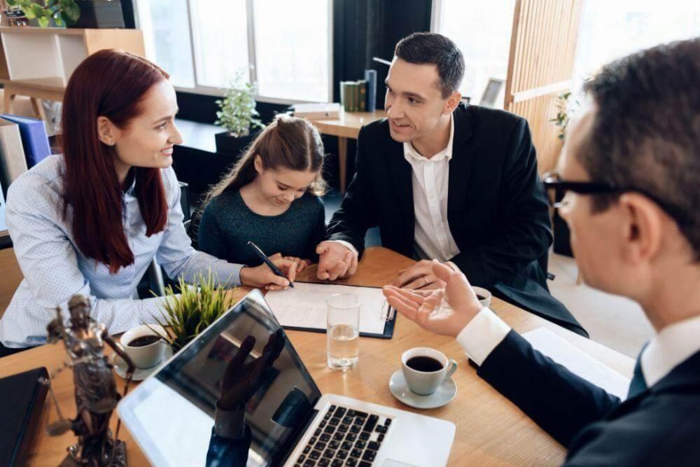 Group of people discussing with a Texas family law attorney