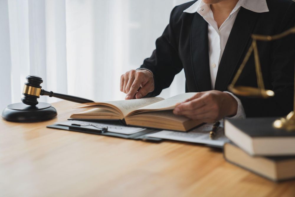 Woman at desk with open book and judge