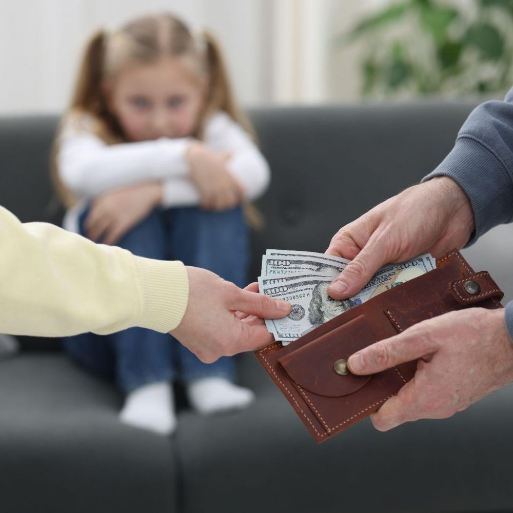 Man giving money to a woman, likely representing