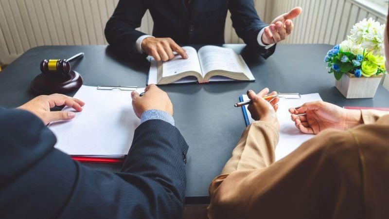 Two people reviewing documents at a table