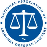 National Association of Criminal Defense Lawyers logo with balance scales in blue circle background.