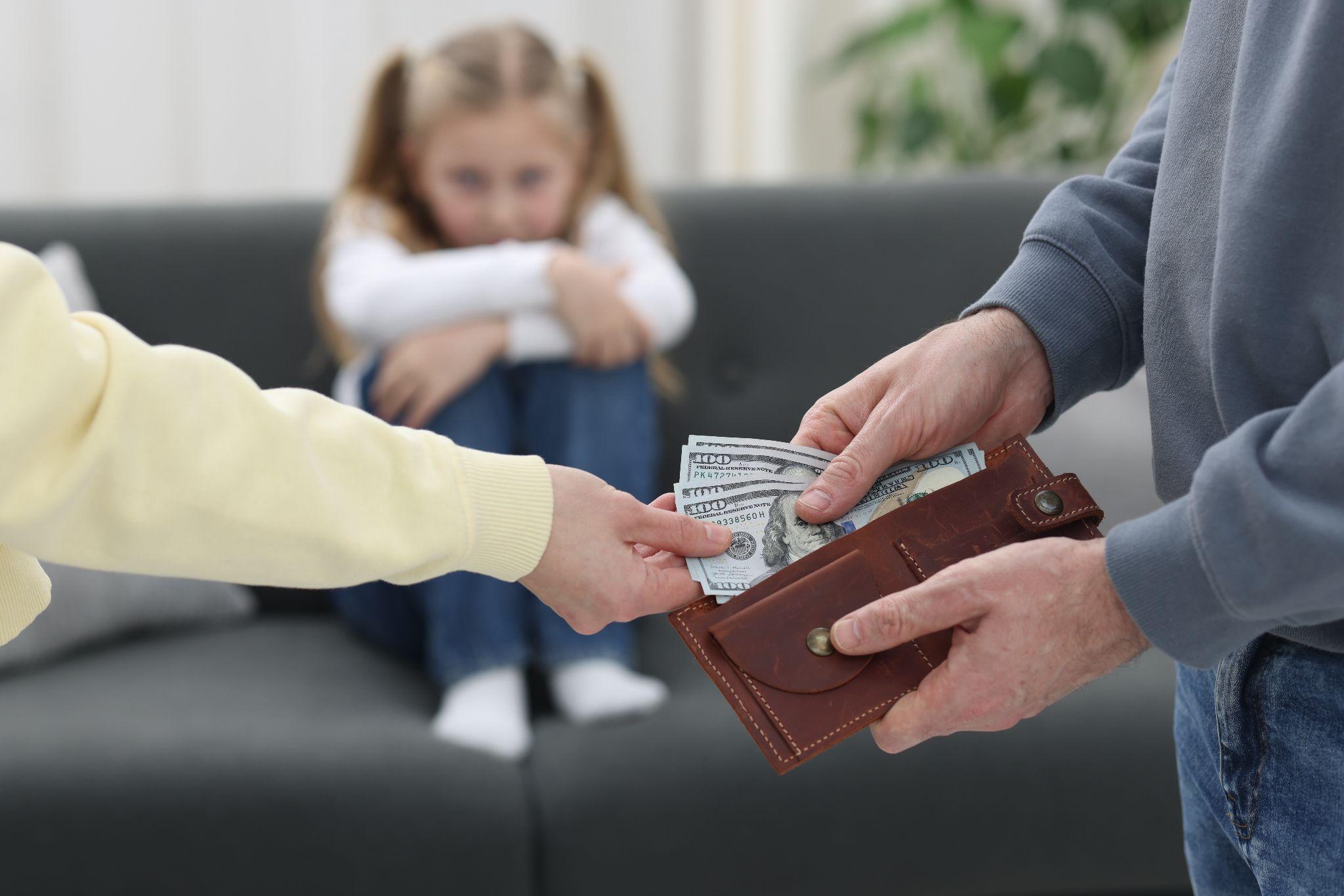 Man giving money to a woman, likely representing