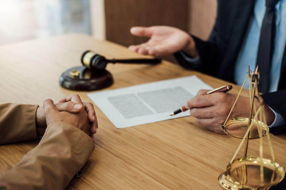 Two people sitting at a table discussing
